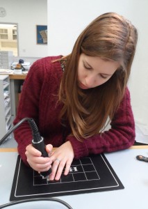 Ultrasonically welding polyethylene strips to Japanese tissue