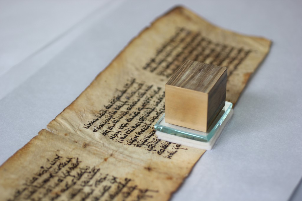 Figure 10: Pressing the parchment with Bondina, two layers of felt, glass, and a brass weight
