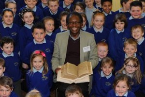 Dr Onesimus Ngundu with Mary Jones' Bible at a Bala primary school